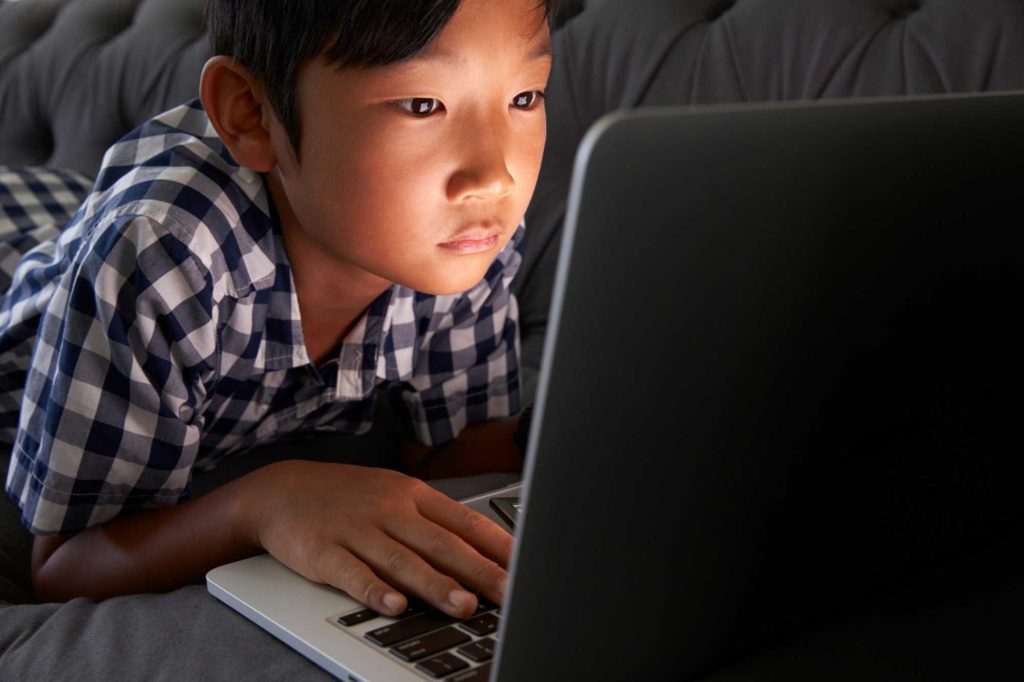 Boy watching online stuff in social media
