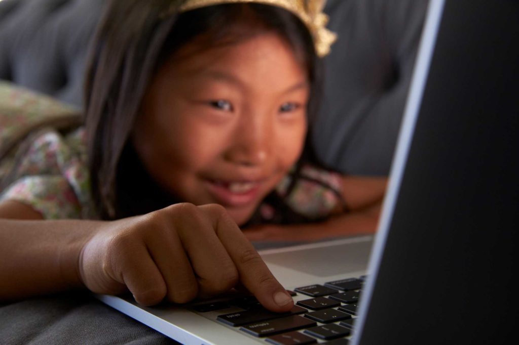 Girl with laptop and on social media