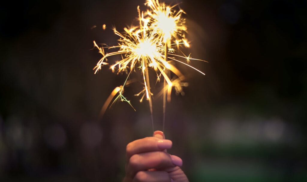 person holding lighted sparkler I New Year's Eve safety tips I Glory Moralidad I Iloilo Blogger